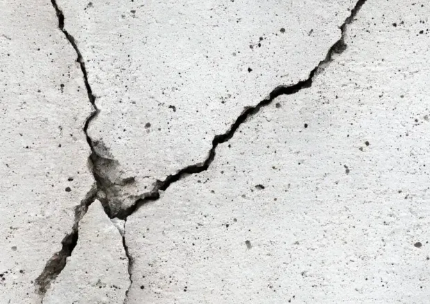 Close view of cracks and broken edges in a concrete slab